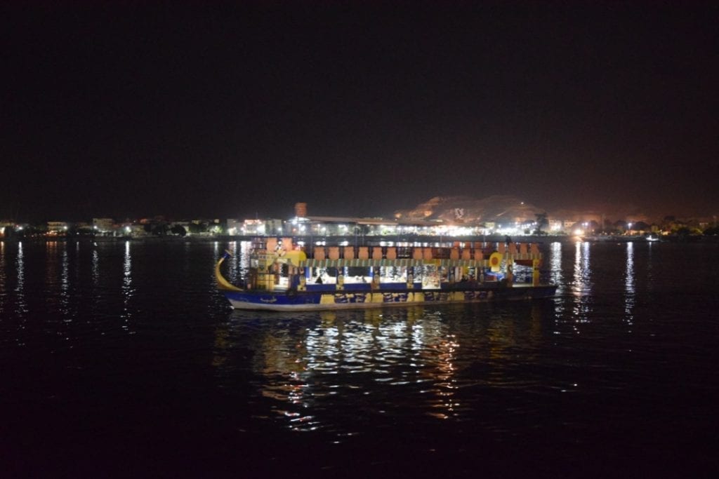 A boat during night time in the Nile river in Luxor. 