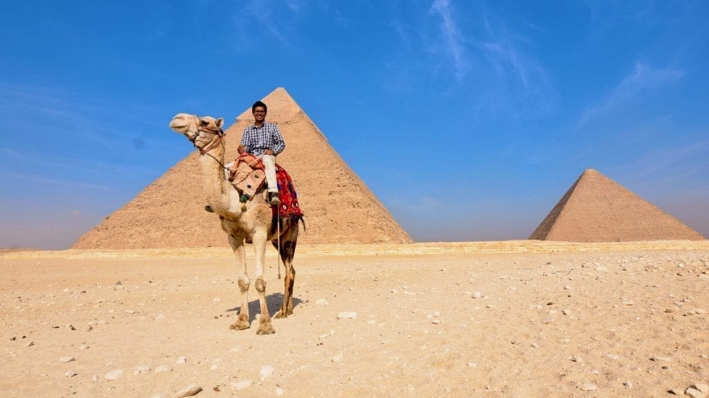 Camel ride in front of pyramid of Giza. 