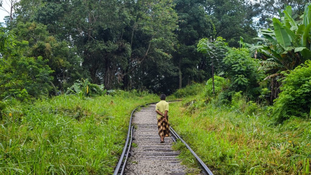 Man Walking on a Train Line in Ella