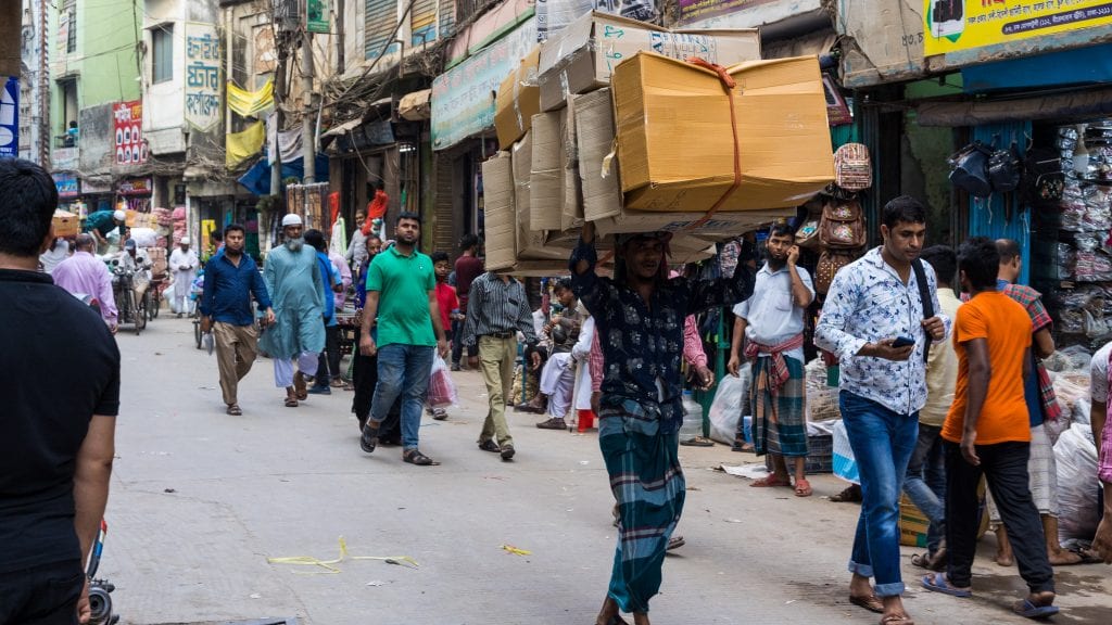 Multiple Packets On Head of a person in Old Dhaka