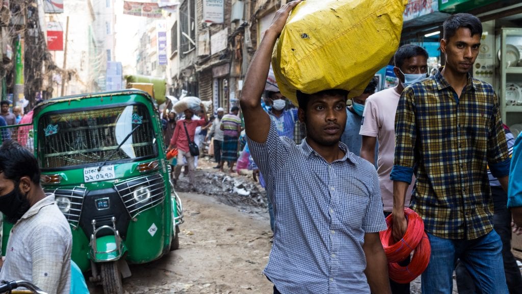 People Carrying Goods in Old Dhaka